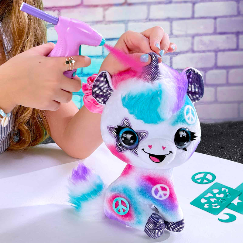 a child using the airbursh painter on a unicorn toy