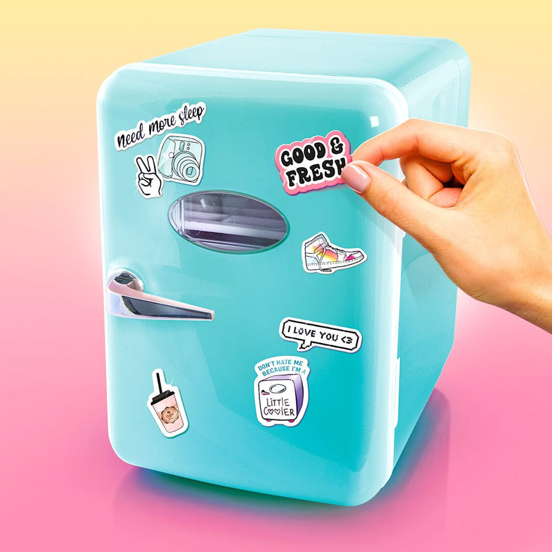 stickers being added to a light blue mini fridge