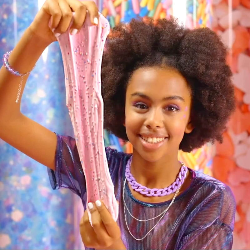 a girl stretching pink slime
