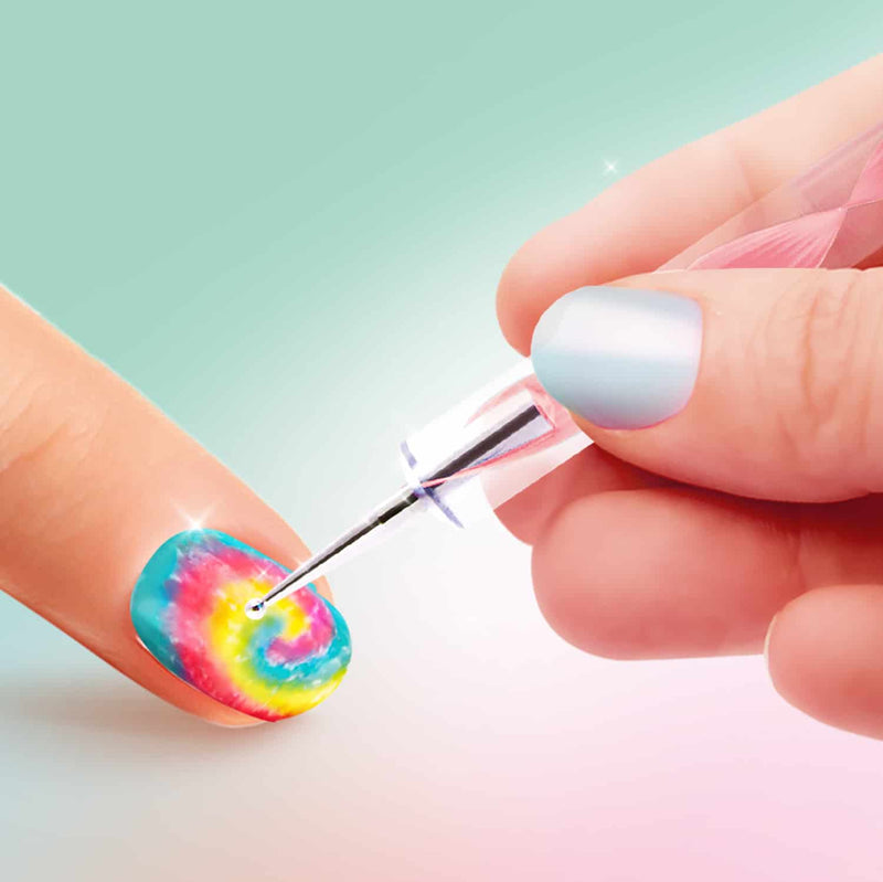 adding gems to a tie dye manicured nail