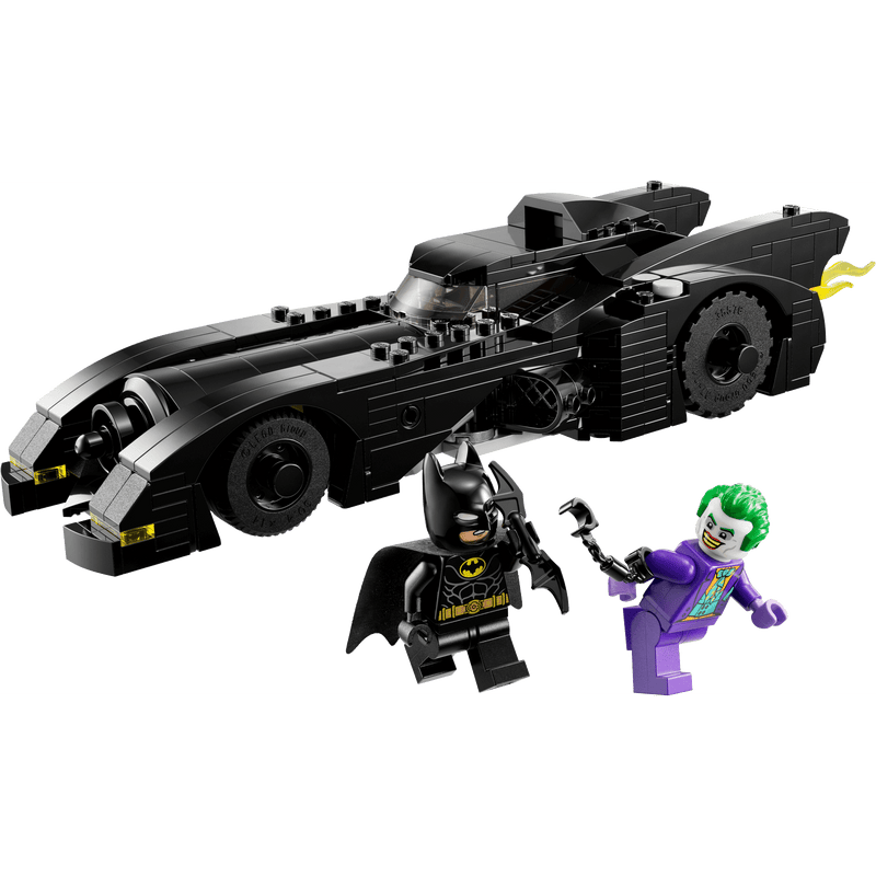 lego minifigure batman and joker next to lego batmobile