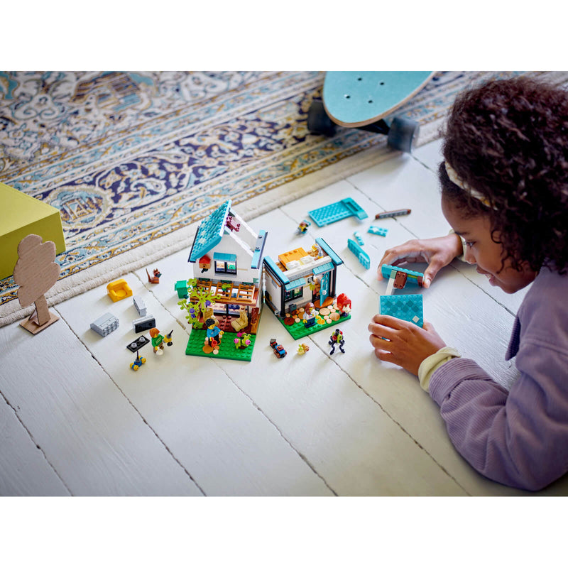 Child building a Lego house