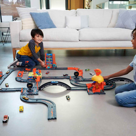 children playing with hot wheels city downtown sets