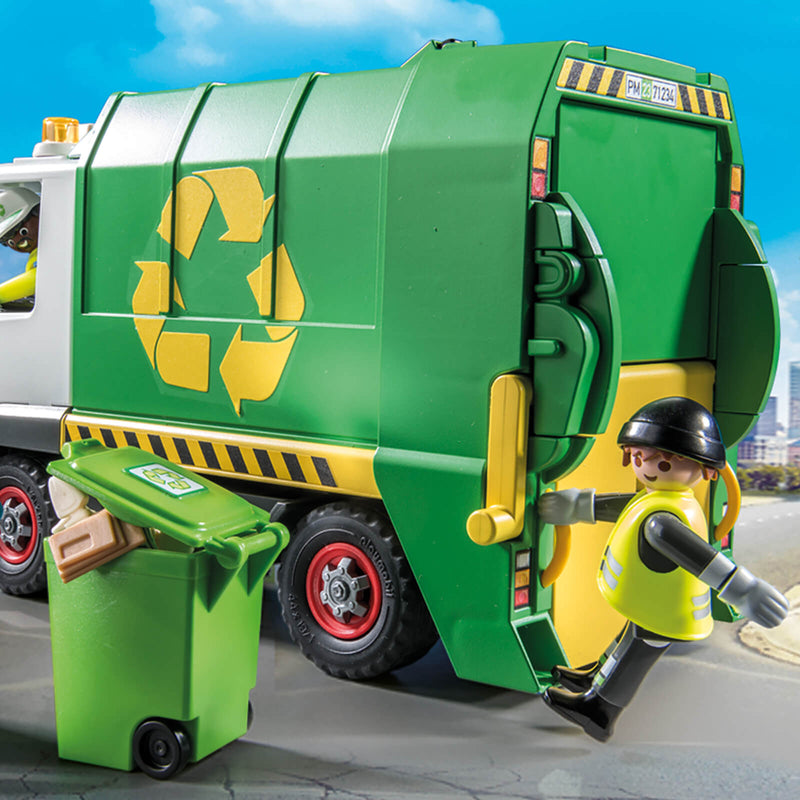 playmobil figure hanging on the back of a recycling truck