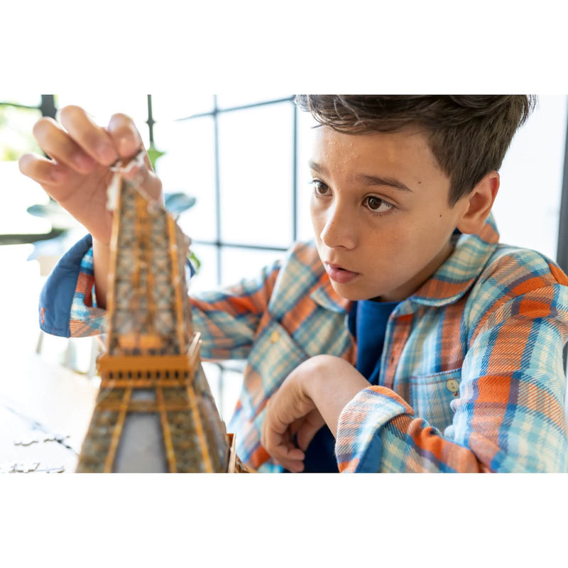 Photo of a child building the 3D eiffel tower jigsaw