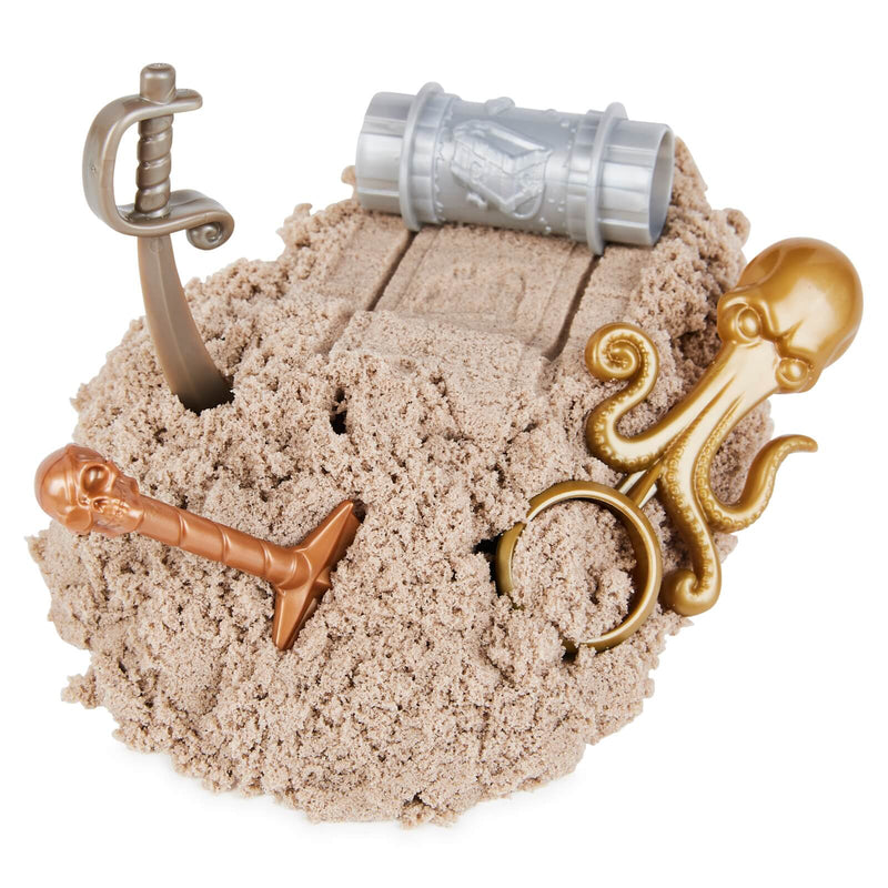 a close up of kinetic sand with hidden toys inside