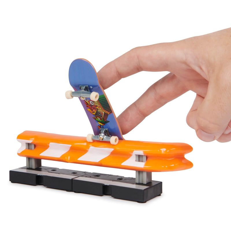 tech deck skateboard grinding on a ramp